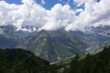 Obraz premium beautiful mountain landscape with green pine forest and sad sky