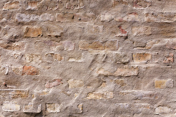 Background or texture of old vintage dirty grunge brick wall with peeling plaster and concrete