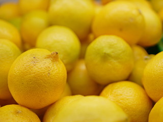 Close up and selective focus background of yellow limes
