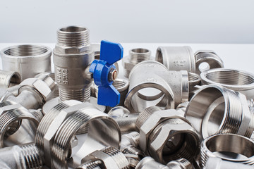 blue metal plumbing tap and sanitary furniture on white background.
