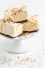 Delicious cake made of meringue and chocolate on white table