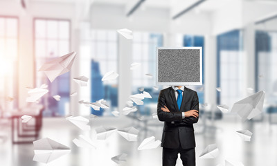 Businessman with monitor instead of head.