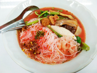 Thai-style noodle soup with fishballs, crispy wonton skin, and special homemade red sauce. 