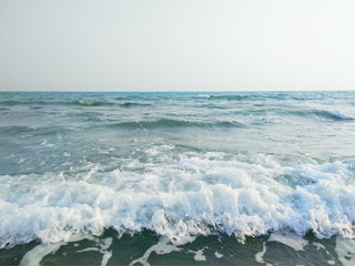 Fototapeta premium Sand beach and sea wave foam on beach in Thailand