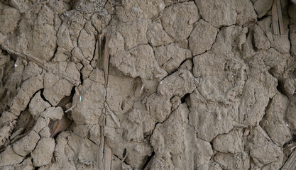 The texture of a cracked clay wall