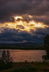 Dramatic sky over Mountains and Lake