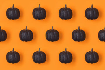 Halloween holiday background pattern with glitter  pumpkin decor
