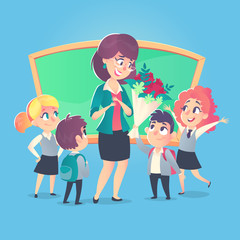 Schoolchildren give flowers to the happy teacher in classroom. Teacher's Day. Back to school.