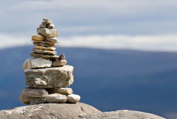 Pile of rocks and pebbles on top of mountain