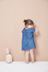 Back view of girl standing .