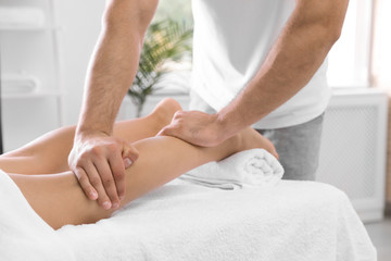 Obraz na płótnie Canvas Young woman receiving massage in salon, closeup