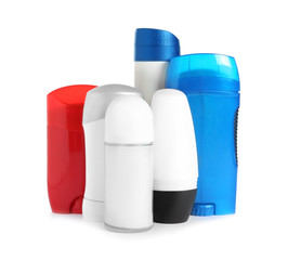 Many different deodorants on white background