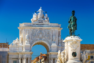 Triumphal arch (1873) and statue in Commerce Square in the city of Lisbon