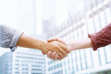 Closeup of a business man hand shake between two colleagues greet , Represents Friendship is...