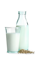 Glassware with hemp milk on white background