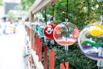 Many glass wind chimes. Wind chimes are symbol item which represents summer in Japan. There are many Japanese wind bells fuurin festival matsuri during summer.