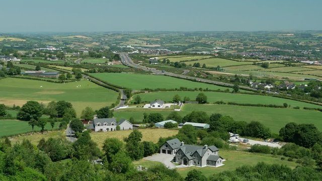 Distant view of the main A1 / N1 cross border road outside of Newry in the UK (Northern Ireland) and close to the Irish border crossing point. Features local countryside in foreground.