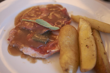 Saltimbocca alla romana (italian vel meat with ham, sauce and sage)