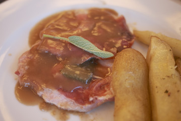 Saltimbocca alla romana (italian vel meat with ham, sauce and sage)
