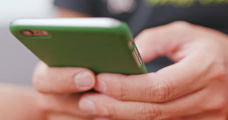 Man use of smart phone at home