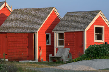 Fototapeta na wymiar Wooden and red cottages in Peggy's Cove, Nova Scotia