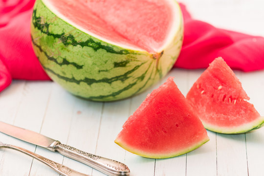 Red watermelon with with the elegant fork and knife
