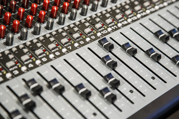 Close-up of the knobs of the mixing console