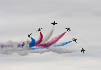 jets in formation with coloured smoke