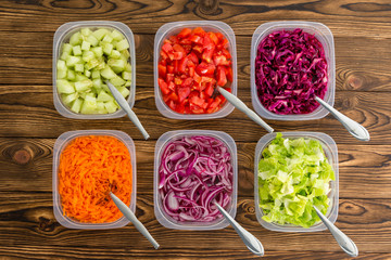 Plastic containers of freshly sliced vegetables