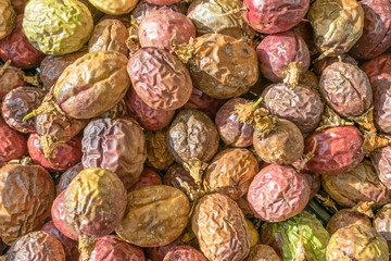 Drying plums fresh from tree and farm to outdoor weekend market in natural light