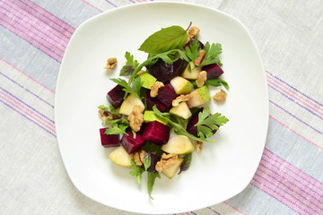 Roasted beets with pear, walnut and arugula