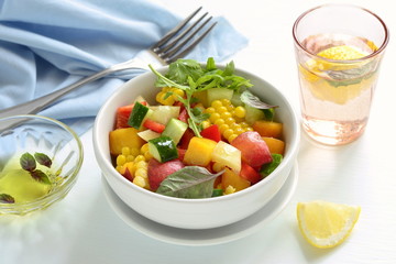 Salad with sweet corn, cucumber, sweet pepper and peach