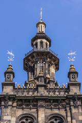 Fototapeta premium Edinburgh, Scotland, UK - June 13, 2012: Tower of Augustine United Church against blue sky. Dark brown stones in Dutch style.