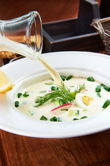 a white plate with okroshka