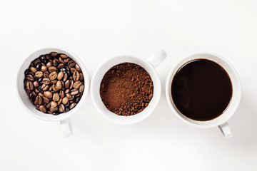 Many cups of coffee on white background
