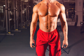 Naklejka na ściany i meble Strong Athletic Man Fitness Model Torso showing six pack abs