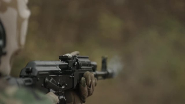 Super slow shooting. Sports shooting. The weapon. Shot from Kalashnikov assault rifle. The trunk of the Kalashnikov assault rifle is large. Deformation in the shot.