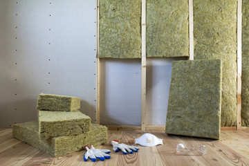 Rock wool and fiberglass insulation staff material for cold barrier. Tools for work with glass...