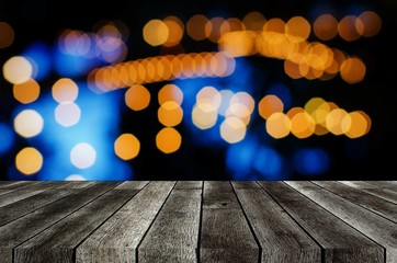 empty gray color modern wooden terrace with abstract night light bokeh of night festival in garden,...