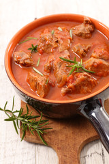 beef cooked with tomato sauce