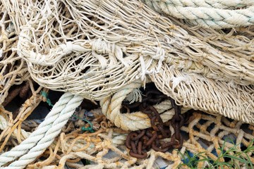 fishing net, ropes and rusty chain