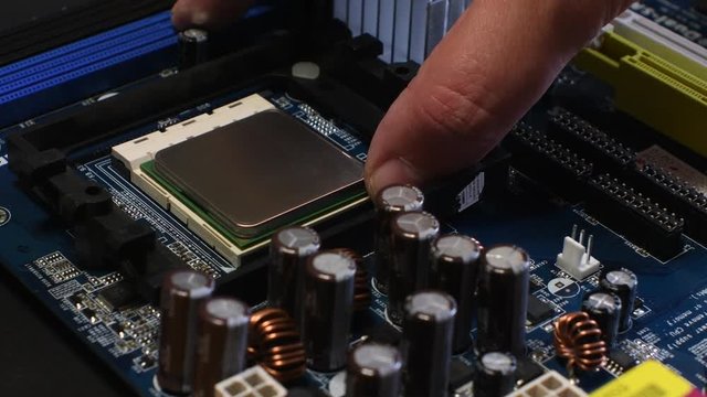 Technician remove CPU microprocessor from a motherboard socket.