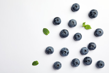 Flat lay composition with tasty blueberry and space for text on white background