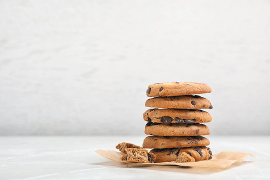 Stack of tasty chocolate cookies on light table
