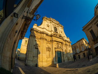Obraz premium Catholic church Santa Maria illuminated at sunrise in Lecce city - Italy
