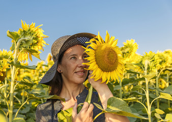 woman and sunflowers