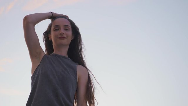 Young hip hop girl with long hair is smiling