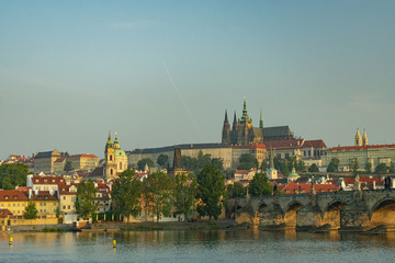 Fototapeta premium View of the panorama of the old historic center of Prague by the river and the Charles Bridge