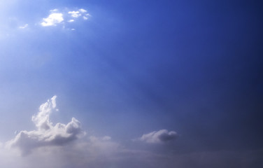Dreamy Blue Sky with White Clouds and God Rays