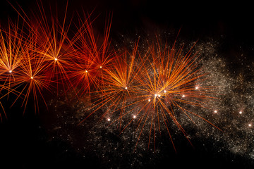 Fototapeta na wymiar Fireworks over black sky